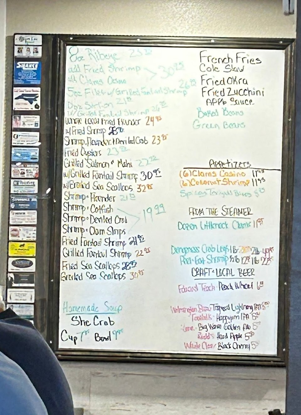 Printed menu showing clams and crab legs.